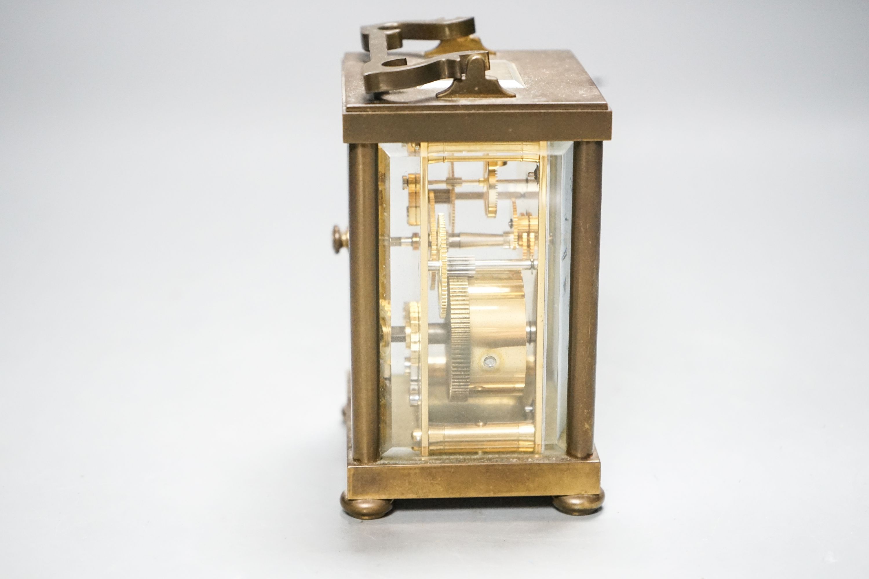 A Matthew Norman brass carriage timepiece, 15 cm high with the handle up